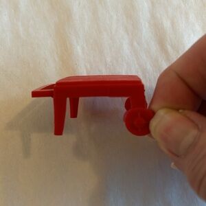 Red doll house gardening seat with wheels has wooden plank pattern - Vintage